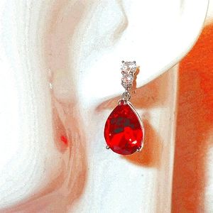 Swarovski red dangling earrings.